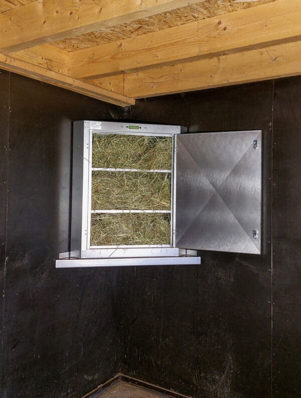 Distributeur de foin automatique Haybutler modèle mural avec goulotte vers le box