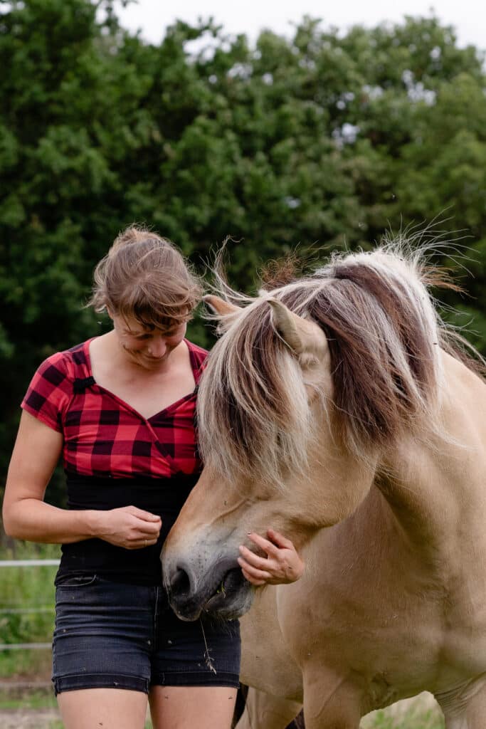 Woman with fjord pony